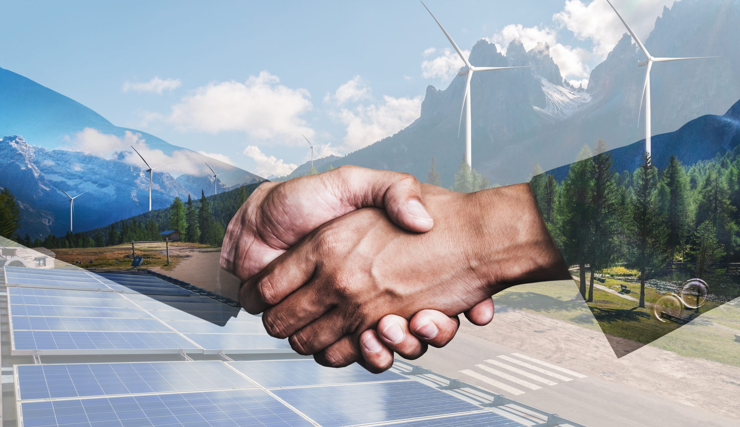 Double exposure graphic of business people handshake over wind turbine farm and green renewable energy worker interface